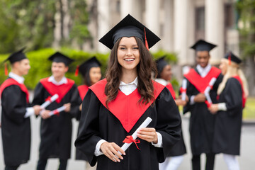 cheerful young woman student having graduation party