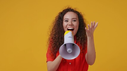 Canvas Print - Excited shocked funny young african american woman 20s years old in red dotted shirt posing isolated on yellow color background studio. People lifestyle concept. Screaming in megaphone spreading hands