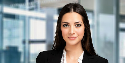 Smiling businesswoman portrait in a modern office