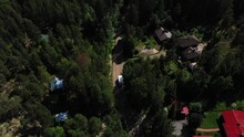 Aerial View Following A Camper, Passing Detached Houses, In Scandinavia - High Angle, Drone Shot