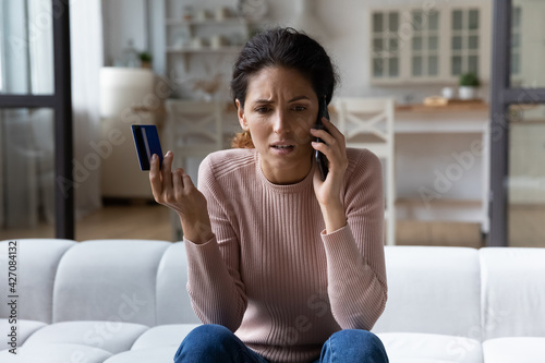 Client support line. Worried young hispanic woman ebank customer contact call center service having problem with payment by credit card. Anxious millennial lady talk to personal bank manager ask help