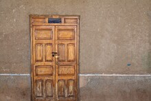 Street Shot Of Front Door Of Adobe Traditional House In Chiquián, Peru.