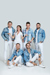 © Rychko Yevhen - happy men and woman in denim t-shirt jeans on studio background.