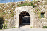 Fototapeta Uliczki - Ancient gateway to enter from the pier to the city in the capital of Corfu