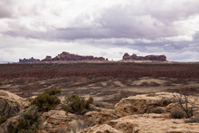 Distant Mesas Across A Rocky Landscape.