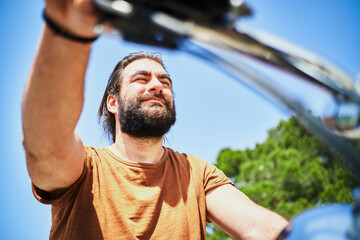 Biker on motorbike in nature. Freedom concept