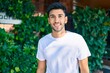 © Krakenimages.com - Young latin man smiling happy walking at the city.