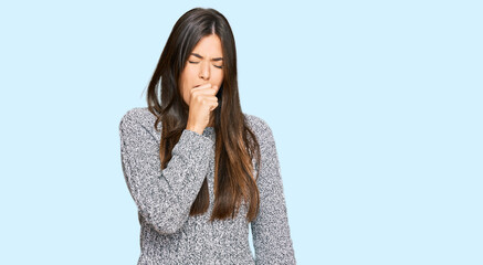 Poster - Young brunette woman wearing casual winter sweater feeling unwell and coughing as symptom for cold or bronchitis. health care concept.