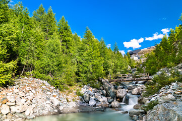 Canvas Print - Findelbach brook at the Pennine Alps in Switzerland