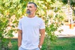 © Krakenimages.com - Middle age grey-haired man smiling happy standing at the park.