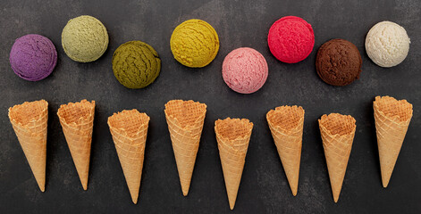 Fototapete - Various of ice cream flavor blueberry ,pistachio ,almond , orange, green tea and chocolate setup on dark stone background . Summer and Sweet menu concept.