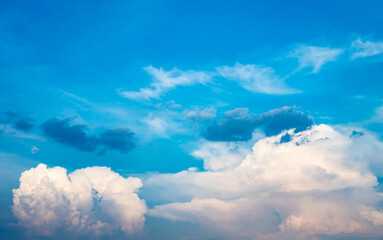 Wall Mural - Abstract white fluffy clouds and  Blue sky in sunny day background.Natural Celestial World  concept with blue sky and clouds  Use as background.