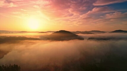 Wall Mural - Foggy sunrise view over mountain lake