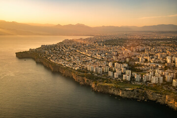 Wall Mural - Antalya cityscape seen from airplane window at sunset, Turkey