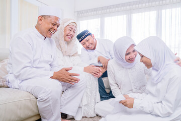 Wall Mural - Child opening envelope from her family at Eid