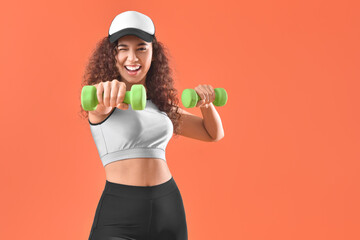 Poster - Beautiful young woman training with dumbbells on color background