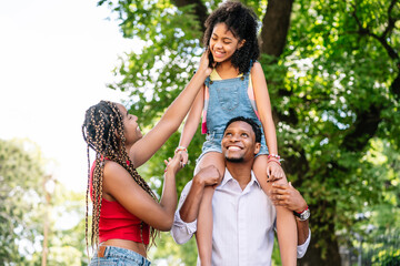 Wall Mural - Family enjoying a walk together outdoors.