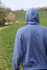 Wall Mural - person standing on the grass, man in nature