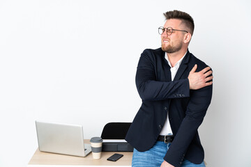 Sticker - Russian man in a office isolated on white background suffering from pain in shoulder for having made an effort