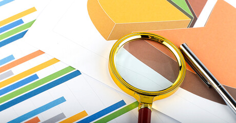 Poster - Graphs, magnifier and pen. Analyzing finances. Concept