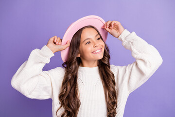 Poster - Portrait of brunette long hairdo sweet girl hands cap wear sweater isolated on violet color background