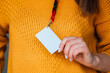 © perfectlab - Woman holding badge name tag, with blank space mock up