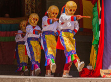 Dancers With Traditional Costumes And Masks During A Religious Performance In The Ancient Kumbum Monastery In The Vicinity Of Xining, Qinghai, China
