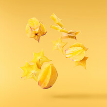 Creative Image With Fresh Yellow Carambola Falling In The Air
