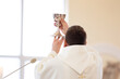 A priest of the Catholic Church raises the chalice in the Catholic Church during the Holy Mass