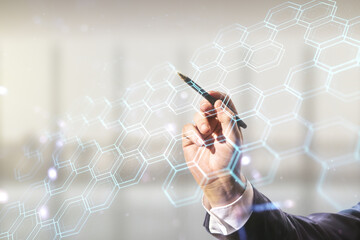 Aufkleber - Man hand with pen draws abstract virtual wireless technology hologram with hexagon on blurred office background, artificial intelligence and machine learning concept. Multi exposure
