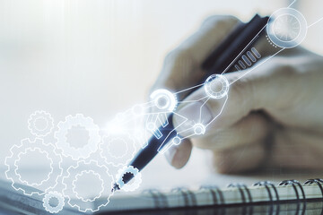 Poster - Double exposure of robotics technology hologram and woman hand writing in notebook on background. Research and development software concept