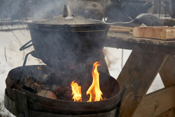 Old pot on an open fire