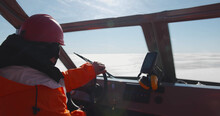 Close Up Of Coast Guard Team Sailing Rescue Boat In Arctic