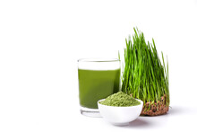 Green Barley Sprout Grass And Bowl Of Green Detox Powder Isolated On White. Copyspace.