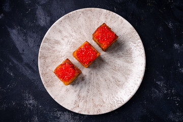 Sticker - toasts with red caviar, foie gras ganache and fried brioche with red caviar