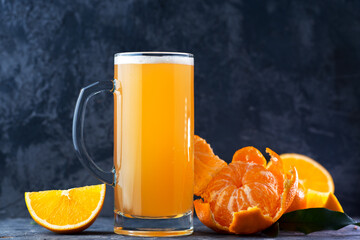 Craft sour beer with orange and tangerine puree, summer refreshing drink