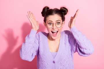 Sticker - Photo portrait of cheerful happy girl amazed gesturing hands wearing stylish pullover isolated on pastel pink color background