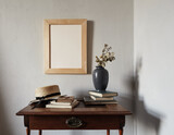 Fototapeta Desenie - Wooden frame mockup. composition with notebook, books, vase with dried flowers on an old wooden table. Modern french interior.