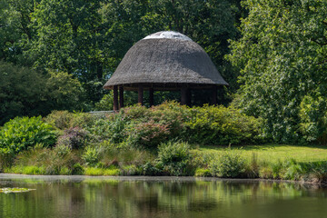 Wall Mural - Lake with pavilion in landscape garden and castle park Lütetsburg