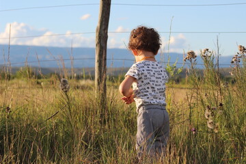 child playing in the field