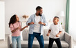© Prostock-studio - African american parent dancing to music with little children