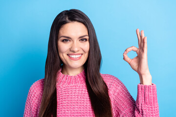 Poster - Photo of charming positive lady fingers show okey symbol look camera isolated on blue color background