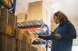 worker using bar code scanner in industry warehouse, logistic technology business to delivery shipping, person checking barcode data to goods product on factory shelf