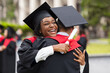 © Prostock-studio - Happy african american couple students hugging, closeup