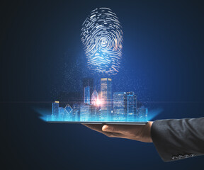 Poster - Hand with a tablet holding a city view hologram on a blue background. Internatonal business and market concept