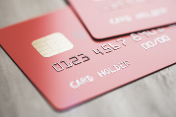 Poster - Online banking system concept with red credit cards on wooden surface