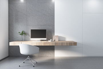 modern home office workplace with concrete and white wall blocks, white chair, wooden table and comp