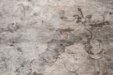 The texture of a wooden table with spots. Grey wood and round stains from drinks glasses. Texture background.