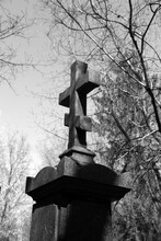 Cross On The Grave In The Cemetery In Black And White