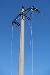 Electricity pole with broken high voltage cables